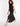 SIDE VIEW WOMEN'S BLACK SATIN HALTER NECK DRESS WITH TIE NECK DETAIL