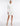 FRONT VIEW CLOUDY WHITE LONG SLEEVE NECK-TIE OPEN BACK MINI DRESS WITH ASYMMETRICAL HEM
