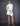 FRONT EDITORIAL VIEW CLOUDY WHITE LONG SLEEVE NECK-TIE OPEN BACK MINI DRESS WITH ASYMMETRICAL HEM