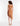 Back view tan knit asymmetrical hem strapless dress