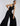 SIDE VIEW WOMEN'S BLACK WIDE-LEG HALTER NECK JUMPSUIT