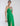SIDE DETAIL VIEW WOMEN'S MALACHITE PLUNGING V-NECK PEPLUM GOWN