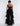 BACK VIEW WOMEN'S BLACK STRAPLESS TIERED TULLE JUMPSUIT GOWN