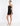 SIDE VIEW BLACK SLEEVELESS A-LINE MINI DRESS WITH PLUNGING NECKLINE AND ILLUSION PANEL
