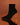black sock boot on a brown background